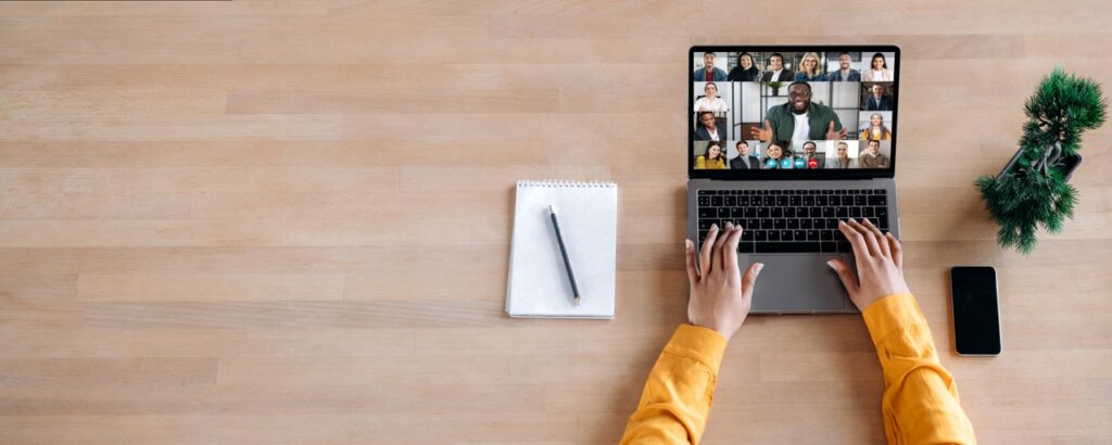 Online business briefing, virtual meeting. Panoramic photo of laptop screen with webcam shots of multi ethnic business partners communicates from home by a video conference, online webinar. Copy space
